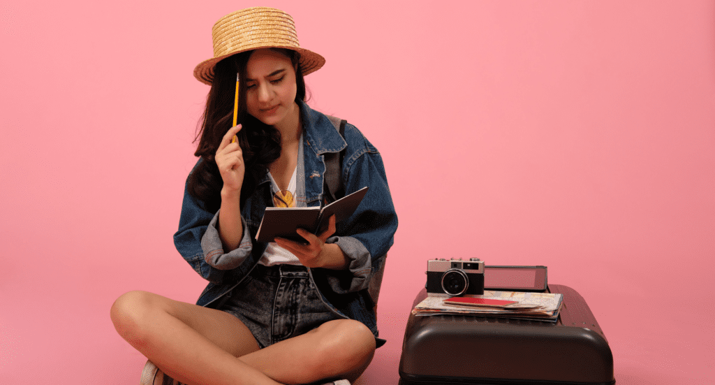 woman backpacker traveler thinking planning with notebook. journey trip travel. studio shot